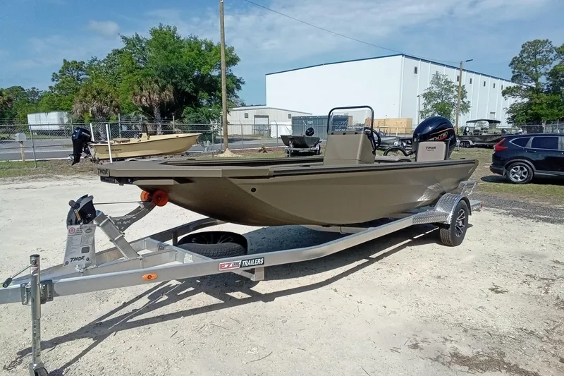 Slide: The Image of 2025 Thor 1900 Lake Hammer boat on trailer in outdoor setting. - 6