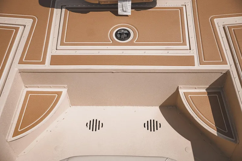 Slide: The Image of 2025 G3 Bay 19 GX boat deck with tan and white design. - 14