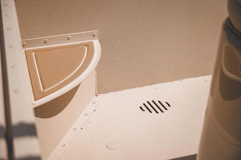 Slide: The Image of Interior detail of 2025 G3 Bay 19 GX boat, featuring textured flooring and drainage. - 17