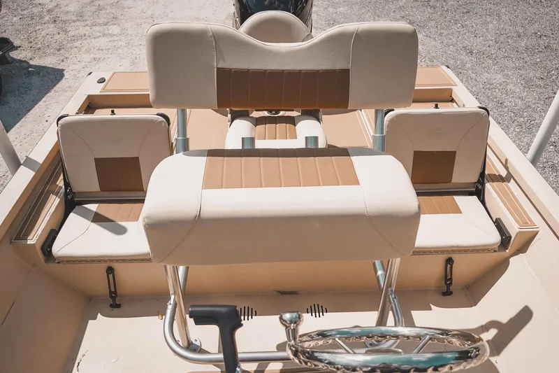 Slide: The Image of 2025 G3 Bay 19 GX boat interior with beige and brown seating. - 21