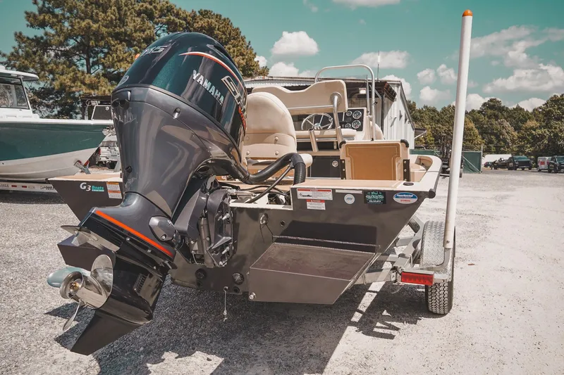 Slide: The Image of 2025 G3 Bay 19 GX boat with Yamaha outboard motor on trailer. - 22