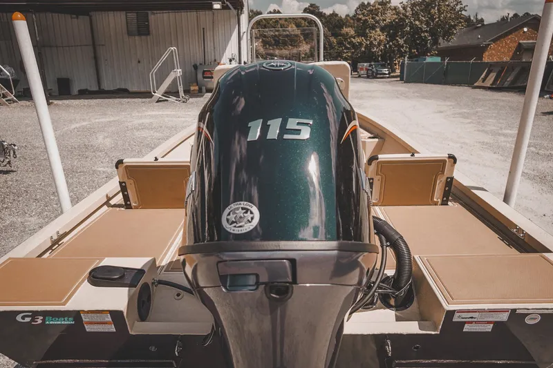 Slide: The Image of 2025 G3 Bay 19 GX boat with powerful 115 engine, parked outdoors. - 23