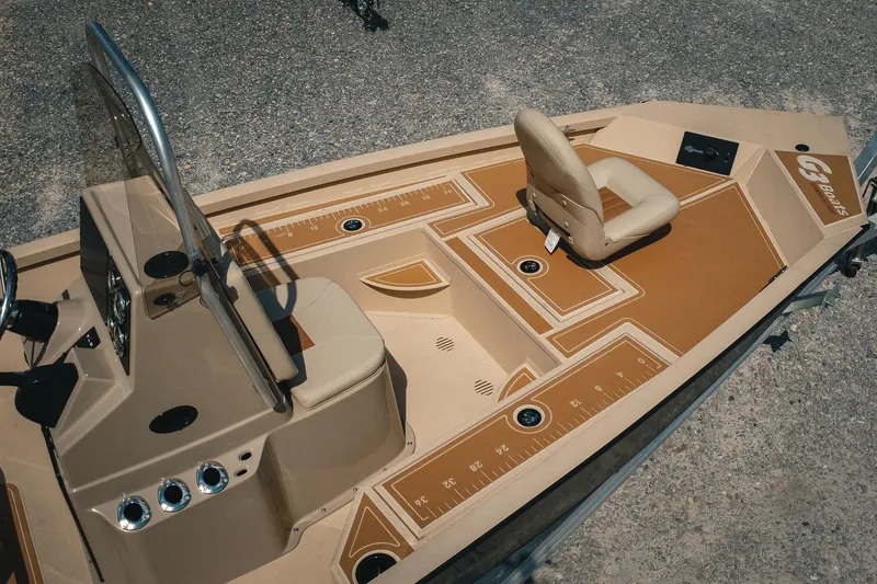 Slide: The Image of 2025 G3 Bay 19 GX boat interior with tan seating and deck layout. - 27