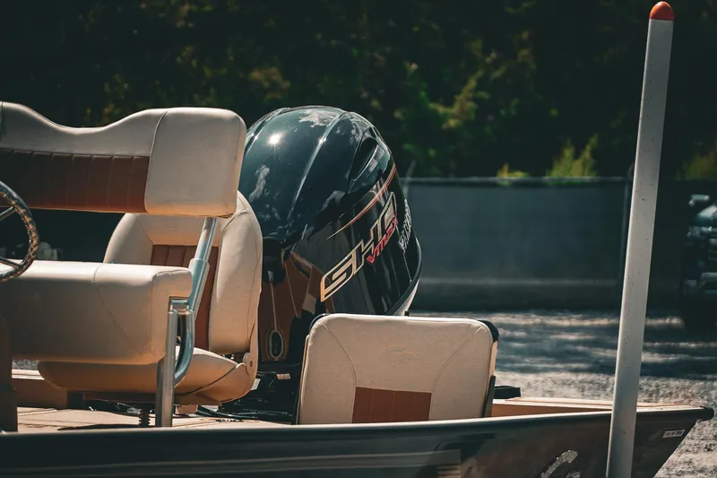 Slide: The Image of 2025 G3 Bay 19 GX boat with outboard motor and beige seating. - 8