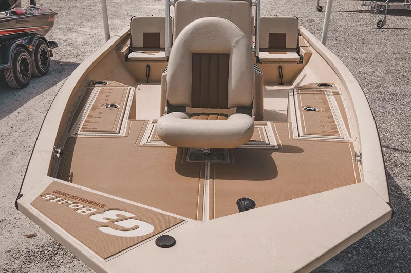 Slide: The Image of 2025 G3 Bay 19 GX boat with beige seating and spacious deck design. - 9