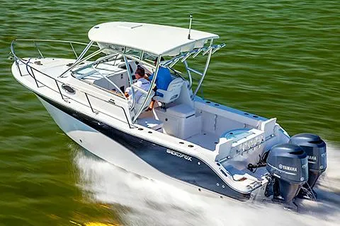 Slide: The Image of Manufacturer Provided Image: 2015 Sea Fox 256 Voyager boat cruising on water with twin Yamaha engines. - 11
