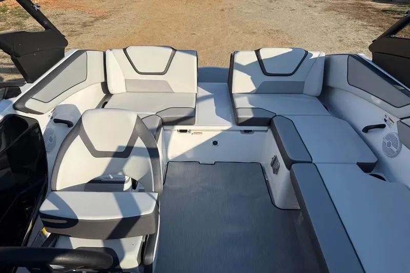 Slide: The Image of 2026 Yamaha Boats AR220 interior with modern seating and sleek design. - 12