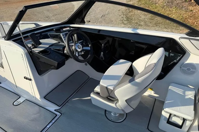 Slide: The Image of 2026 Yamaha Boats AR220 cockpit with modern steering and seating design. - 8
