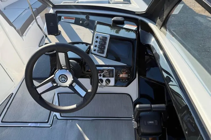 Slide: The Image of 2026 Yamaha Boats AR220 dashboard with steering wheel and control panel. - 9