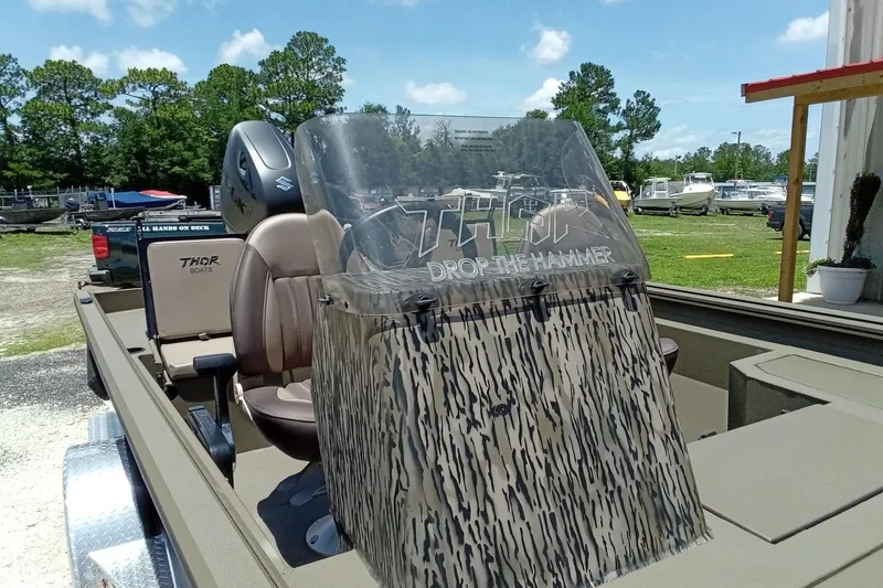 Slide: The Image of 2026 Thor 1900 Lake Hammer SC boat with camouflage windshield and comfortable seating. - 10