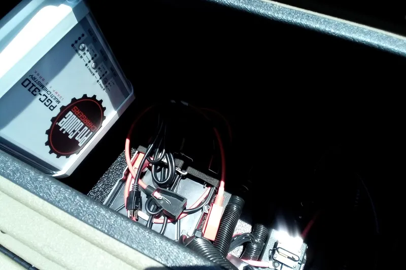 Slide: The Image of Battery compartment of 2026 Thor 1900 Lake Hammer SC with wiring and charger. - 24