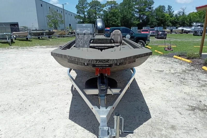 Slide: The Image of 2026 Thor 1900 Lake Hammer SC boat on trailer in outdoor setting. - 6