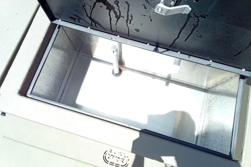 Slide: The Image of Open storage compartment in 2026 Thor 1900 Lake Hammer SC boat, showing interior details. - 18