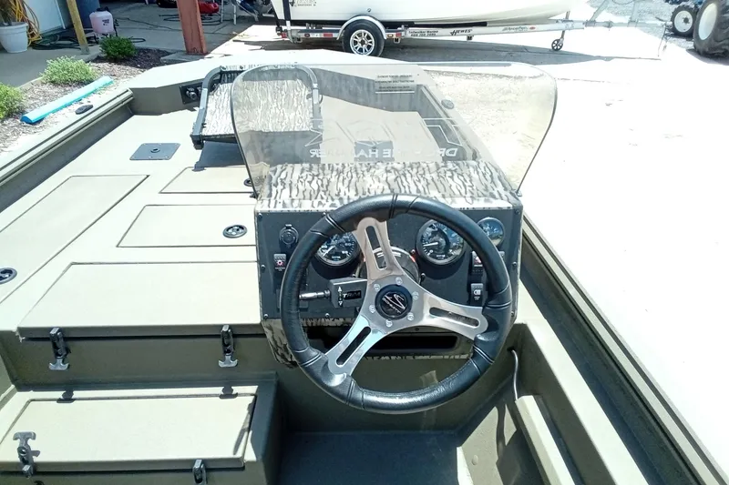 Slide: The Image of 2026 Thor 1900 Lake Hammer SC boat interior with steering wheel and dashboard controls. - 21
