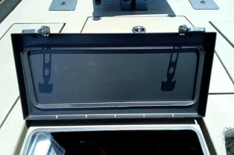Slide: The Image of Open storage compartment on 2026 Thor 1900 Lake Hammer SC boat deck. - 26