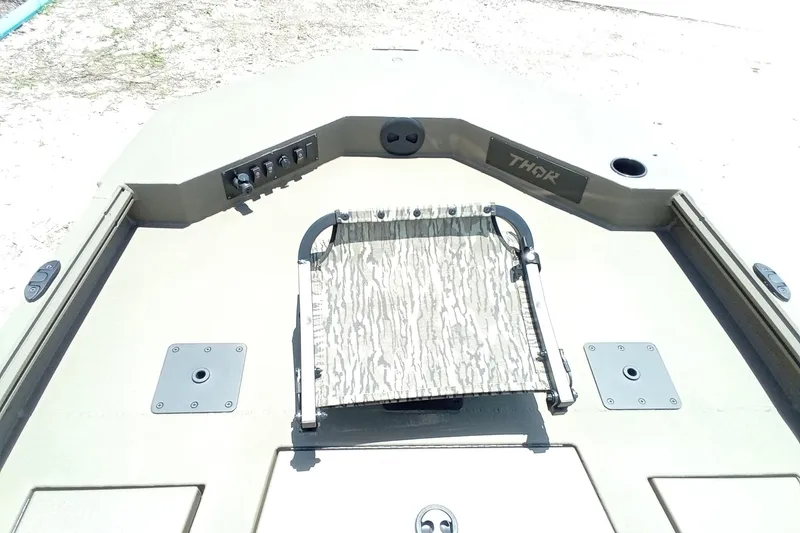 Slide: The Image of 2026 Thor 1900 Lake Hammer SC boat deck with camouflage seat and control panel. - 31