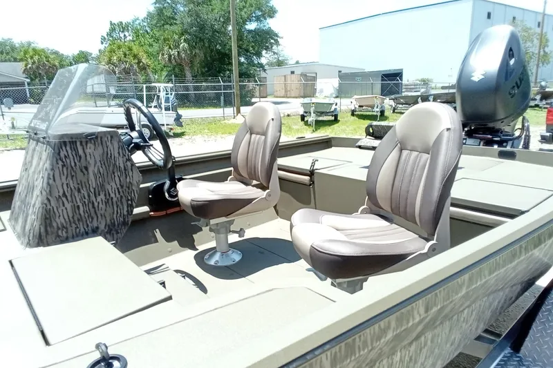Slide: The Image of 2026 Thor 1900 Lake Hammer SC boat interior with two seats and steering console. - 33