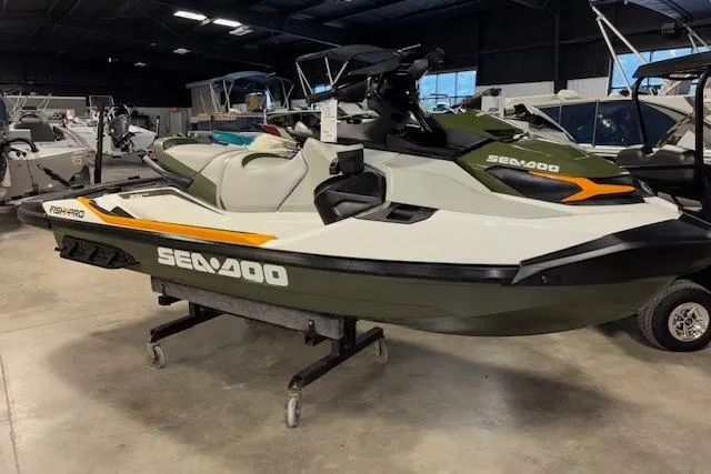 The Image of 2020 Sea-Doo FISH PRO jet ski in showroom, olive and white color scheme. - 1