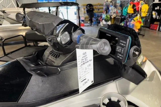 Slide: The Image of 2020 Sea-Doo FISH PRO dashboard with controls and display in a showroom setting. - 13