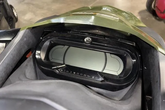 Slide: The Image of 2020 Sea-Doo FISH PRO dashboard with digital display in a garage setting. - 14