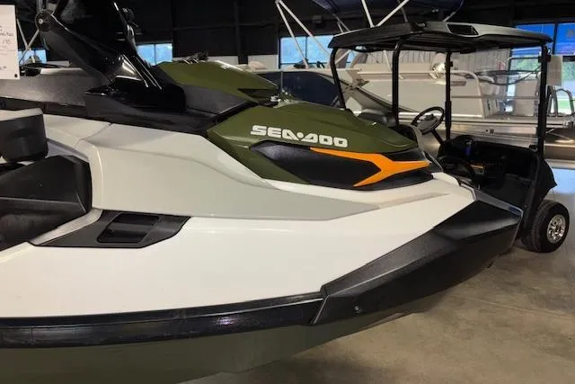 Slide: The Image of 2020 Sea-Doo FISH PRO jet ski in showroom, featuring sleek design and vibrant colors. - 18