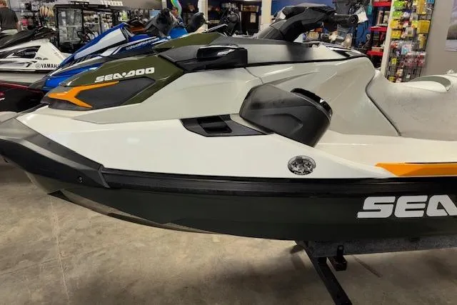 Slide: The Image of 2020 Sea-Doo FISH PRO jet ski displayed in a showroom setting. - 4
