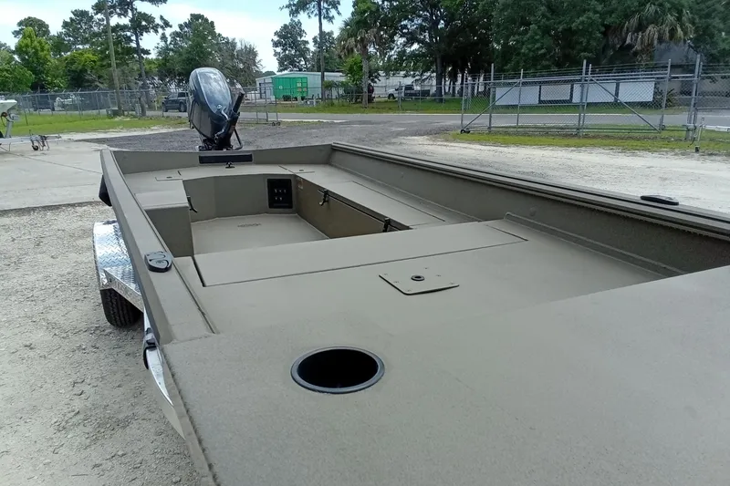 Slide: The Image of 2026 Thor 1754 Timber Hammer boat on trailer, parked outdoors. - 10