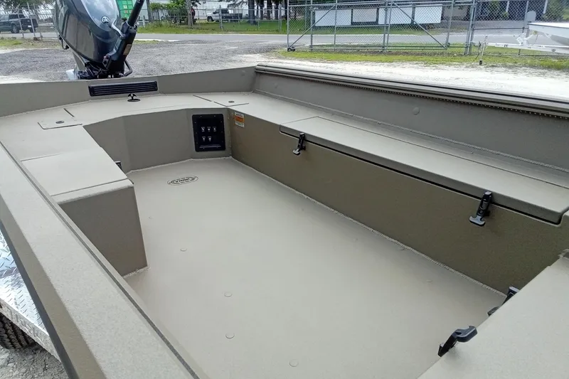 Slide: The Image of 2026 Thor 1754 Timber Hammer boat interior with storage compartments and motor. - 11