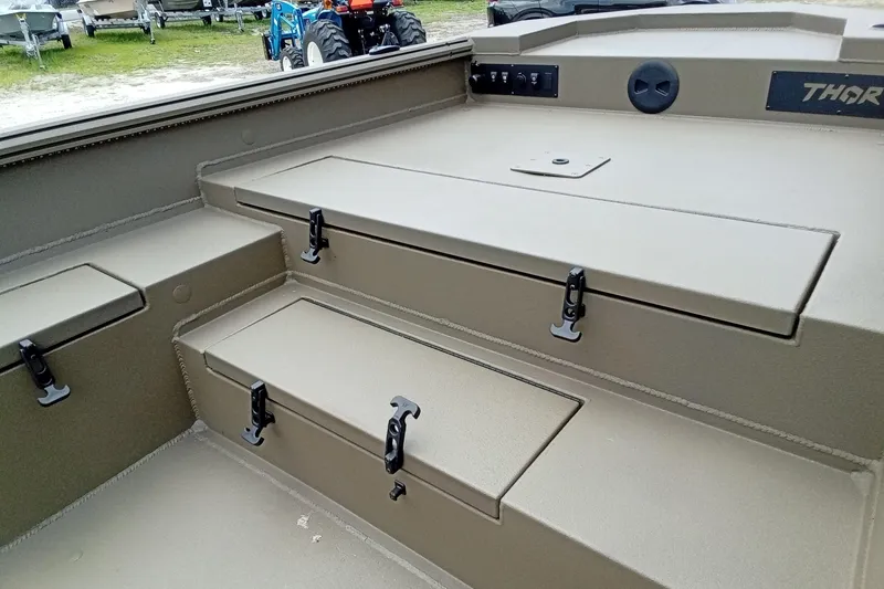 Slide: The Image of 2026 Thor 1754 Timber Hammer boat interior with storage compartments and latches. - 12