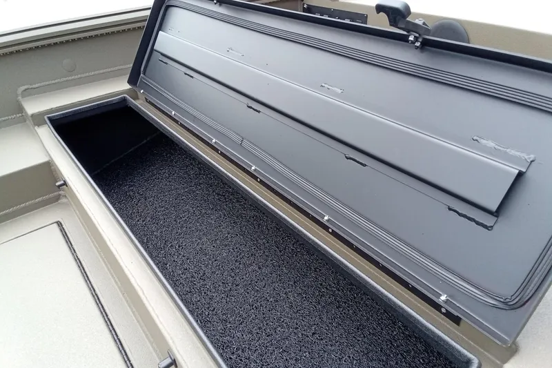 Slide: The Image of Open storage compartment in a 2026 Thor 1754 Timber Hammer boat. - 13