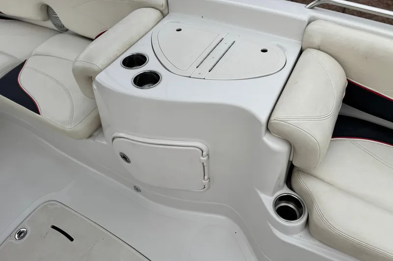 Slide: The Image of 2014 Tahoe 215 boat interior with white seating and cup holders. - 18