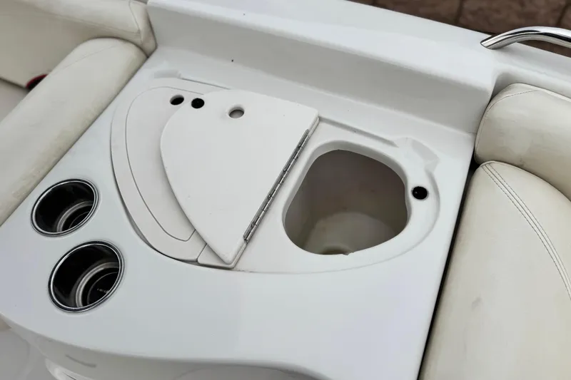 Slide: The Image of 2014 Tahoe 215 boat interior with cup holders and storage compartment. - 20