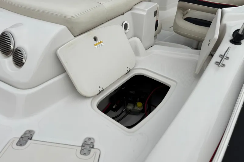 Slide: The Image of 2014 Tahoe 215 boat interior with open storage compartment. - 8