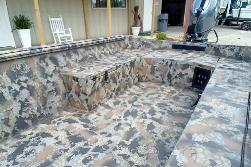 Slide: The Image of Camouflage interior of 2026 Thor 1754 Timber Hammer boat, featuring spacious seating and modern design. - 12