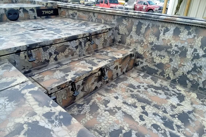 Slide: The Image of Camouflage interior of 2026 Thor 1754 Timber Hammer boat with storage compartments. - 13