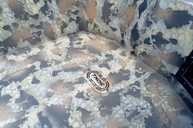 Slide: The Image of Camouflage interior of 2026 Thor 1754 Timber Hammer boat with logo detail. - 14