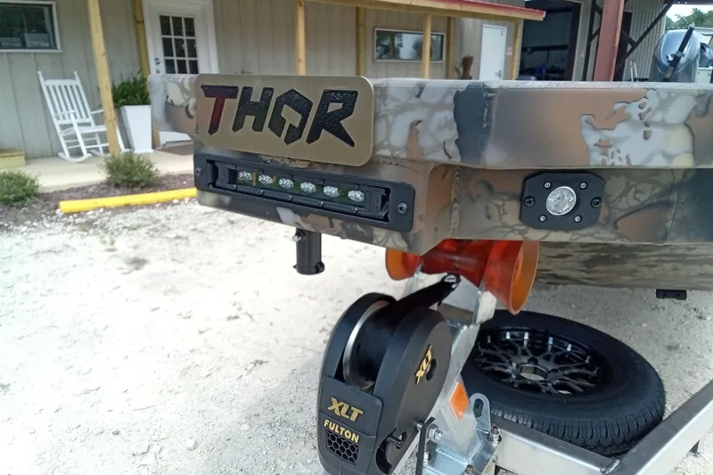Slide: The Image of 2026 Thor 1754 Timber Hammer boat with camo design and LED lights. - 5