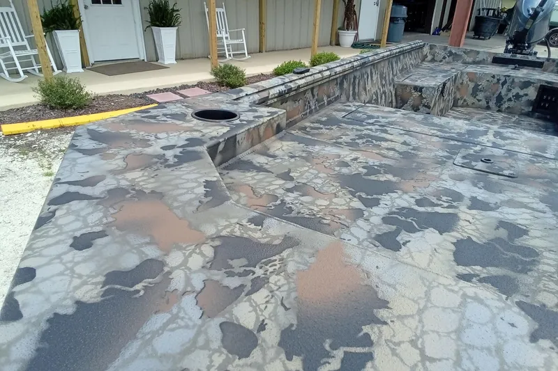 Slide: The Image of Camouflage-patterned deck of 2026 Thor 1754 Timber Hammer boat, outdoor setting. - 7