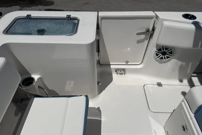 Slide: The Image of 2026 Robalo R300 Center Console boat interior with storage and seating. - 13
