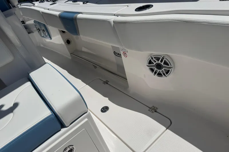 Slide: The Image of 2026 Robalo R300 Center Console boat interior with seating and speaker detail. - 16