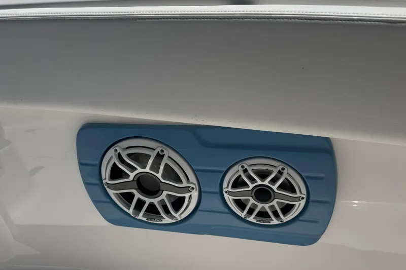Slide: The Image of 2026 Robalo R300 Center Console boat speakers with blue mounting panel. - 18