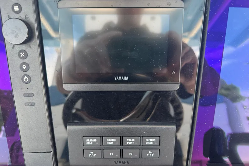 Slide: The Image of 2026 Robalo R300 Center Console dashboard with Yamaha display and control panel. - 22