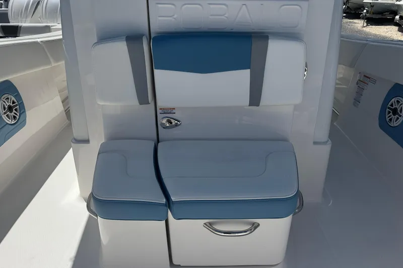 Slide: The Image of 2026 Robalo R300 Center Console boat seat with blue and white cushioned design. - 28