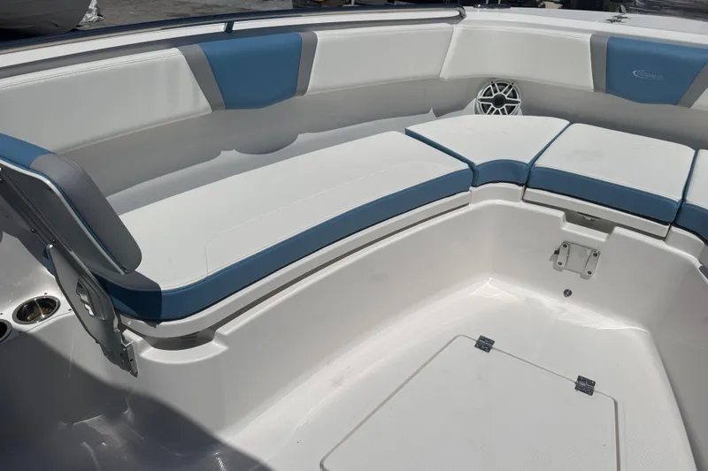 Slide: The Image of 2026 Robalo R300 Center Console boat interior with blue and white cushioned seating. - 32