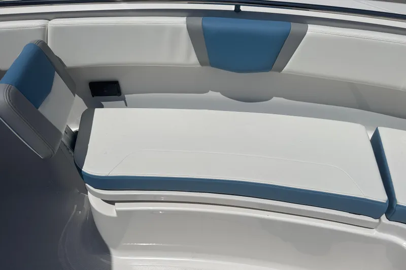 Slide: The Image of 2026 Robalo R300 Center Console boat seating with blue and white upholstery. - 33