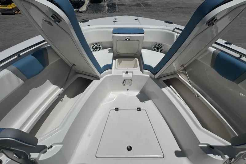 Slide: The Image of 2026 Robalo R300 Center Console boat interior with open storage compartments. - 35