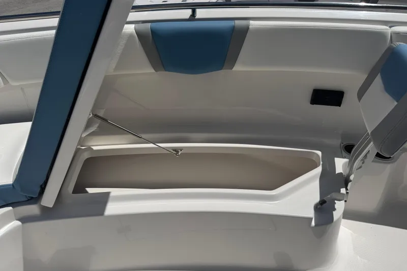 Slide: The Image of 2026 Robalo R300 Center Console boat interior with open storage compartment. - 36