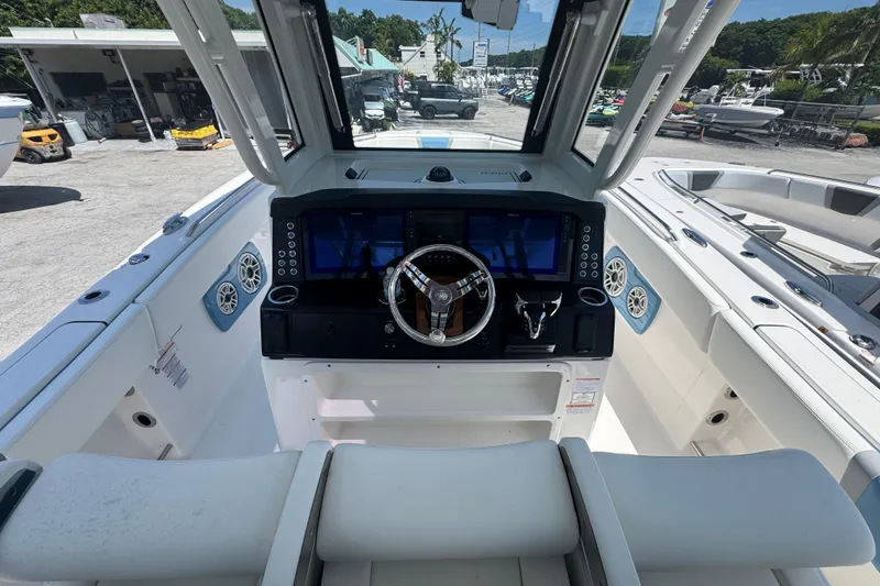 Slide: The Image of 2026 Robalo R300 Center Console boat interior with modern helm and seating. - 9