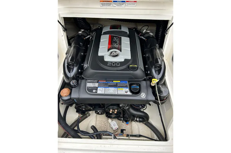 Slide: The Image of 2021 Bayliner VR4 Bowrider OB engine compartment with Mercury 4.5L 200 HP motor. - 2