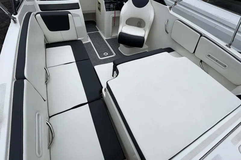 Slide: The Image of 2021 Bayliner VR4 Bowrider OB interior with white and black seating arrangement. - 7